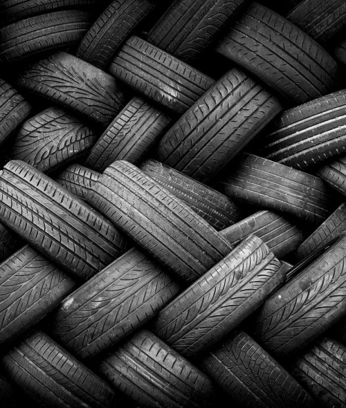 Pile,Of,Old,Tires,Neatly,Arranged.